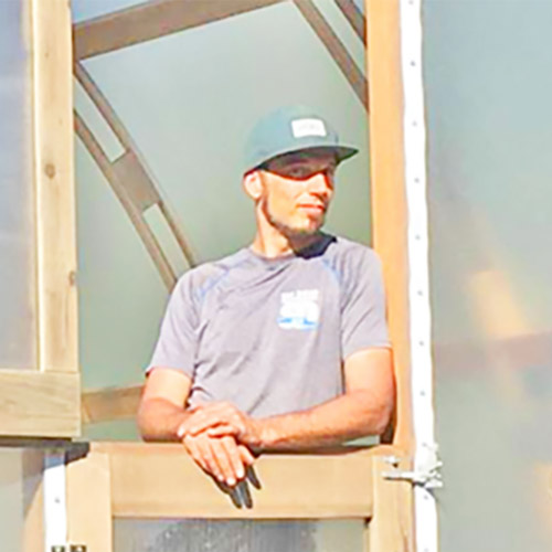 Davide-Luchetta owner of Argenta Greenhouse Co. stands inside a new greenhouse
